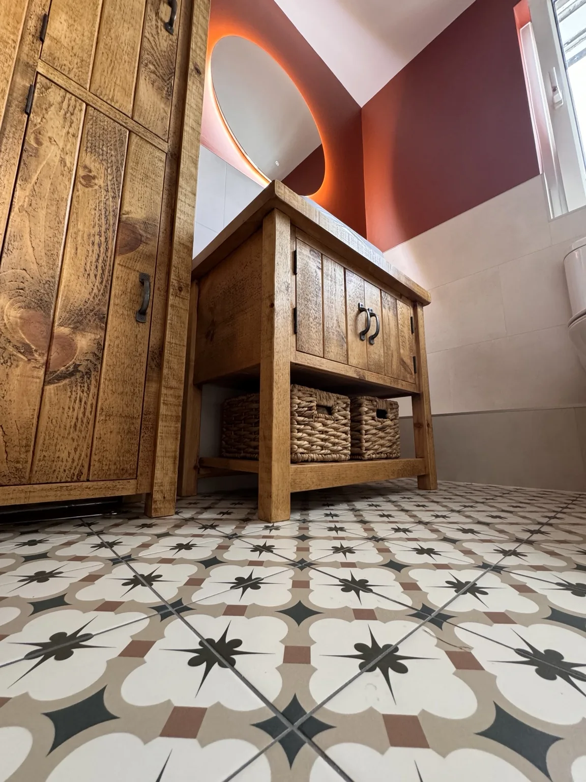 Handmade furniture and patterned floor tiles