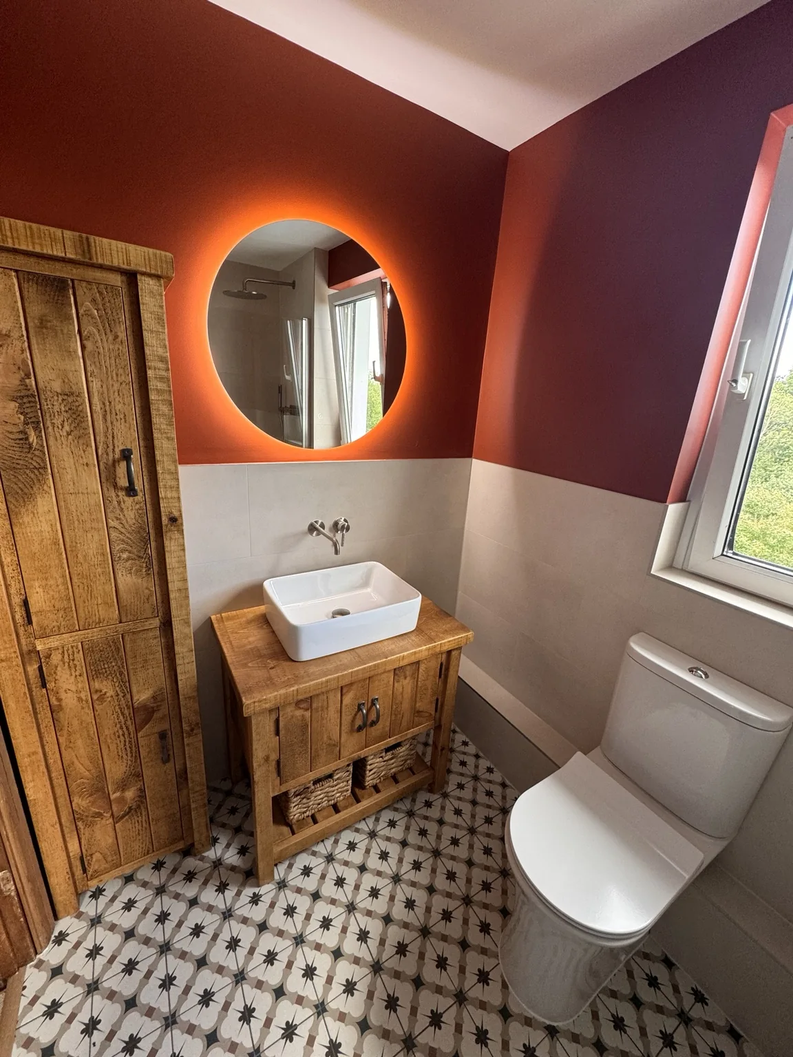 Timber furniture, countertop basin and illuminated mirror