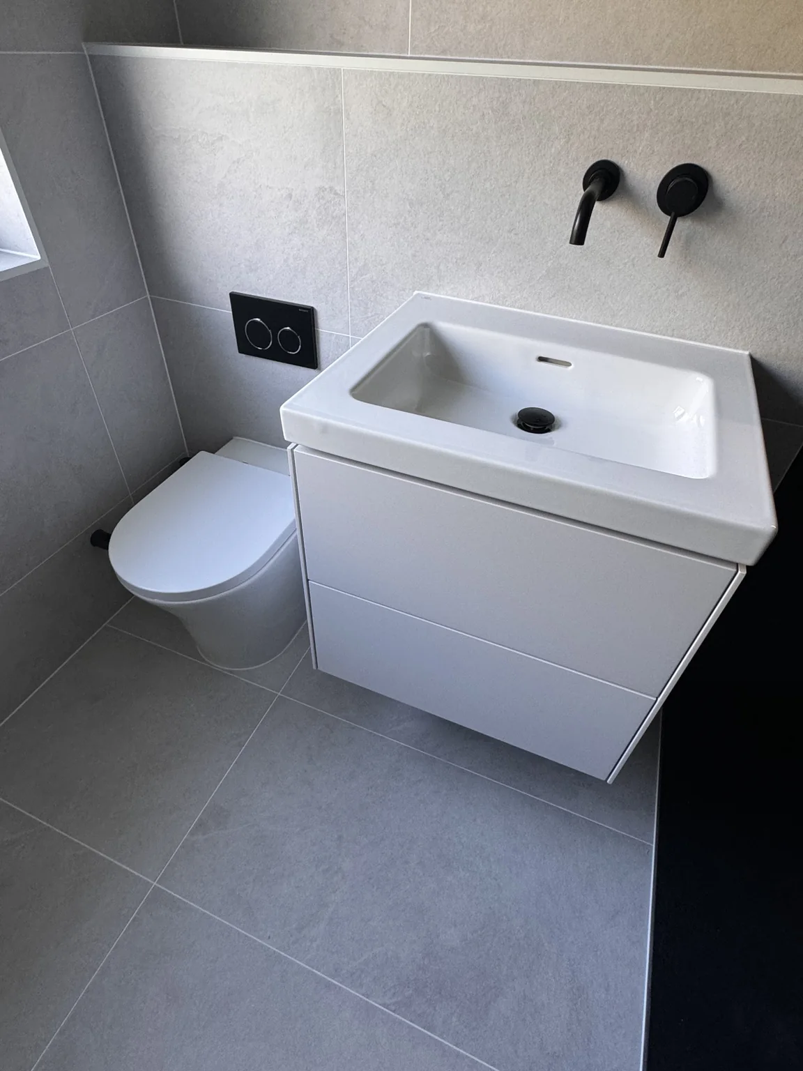 Basin, floating vanity and Geberit flush plate